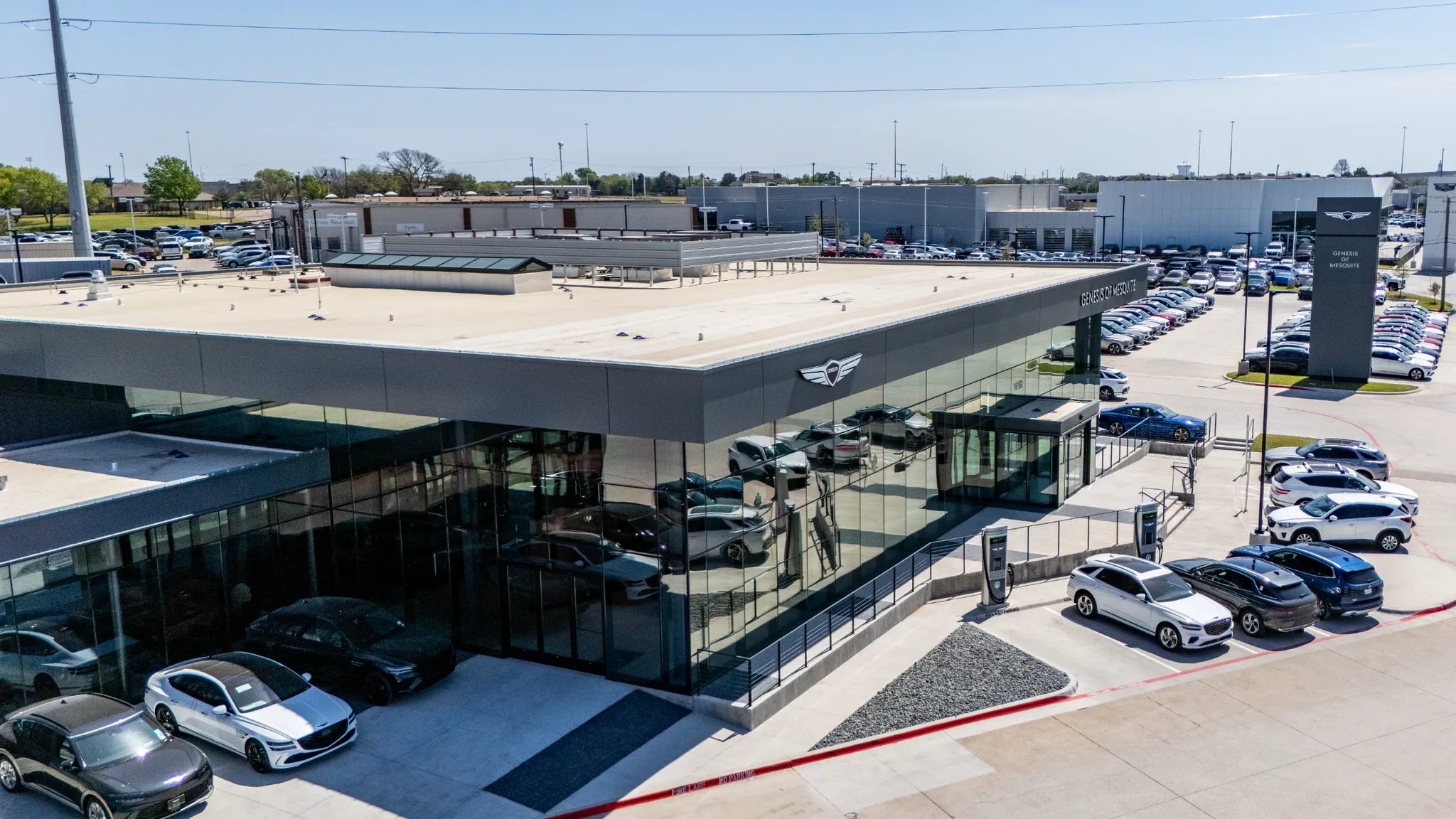 Aerial corner view of Clay Cooley Genesis of Mesquite in Mesquite, Texas, with its cantilevered canopy, built by The Charles Morgan Group