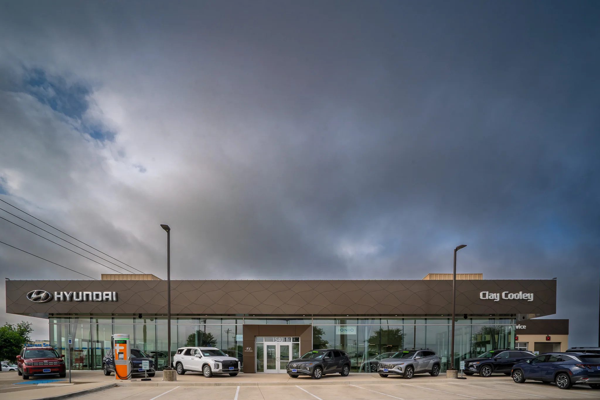 Front elevation of Clay Cooley Hyundai of Rockwall in Rockwall, Texas, under a stormy sky, built by The Charles Morgan Group
