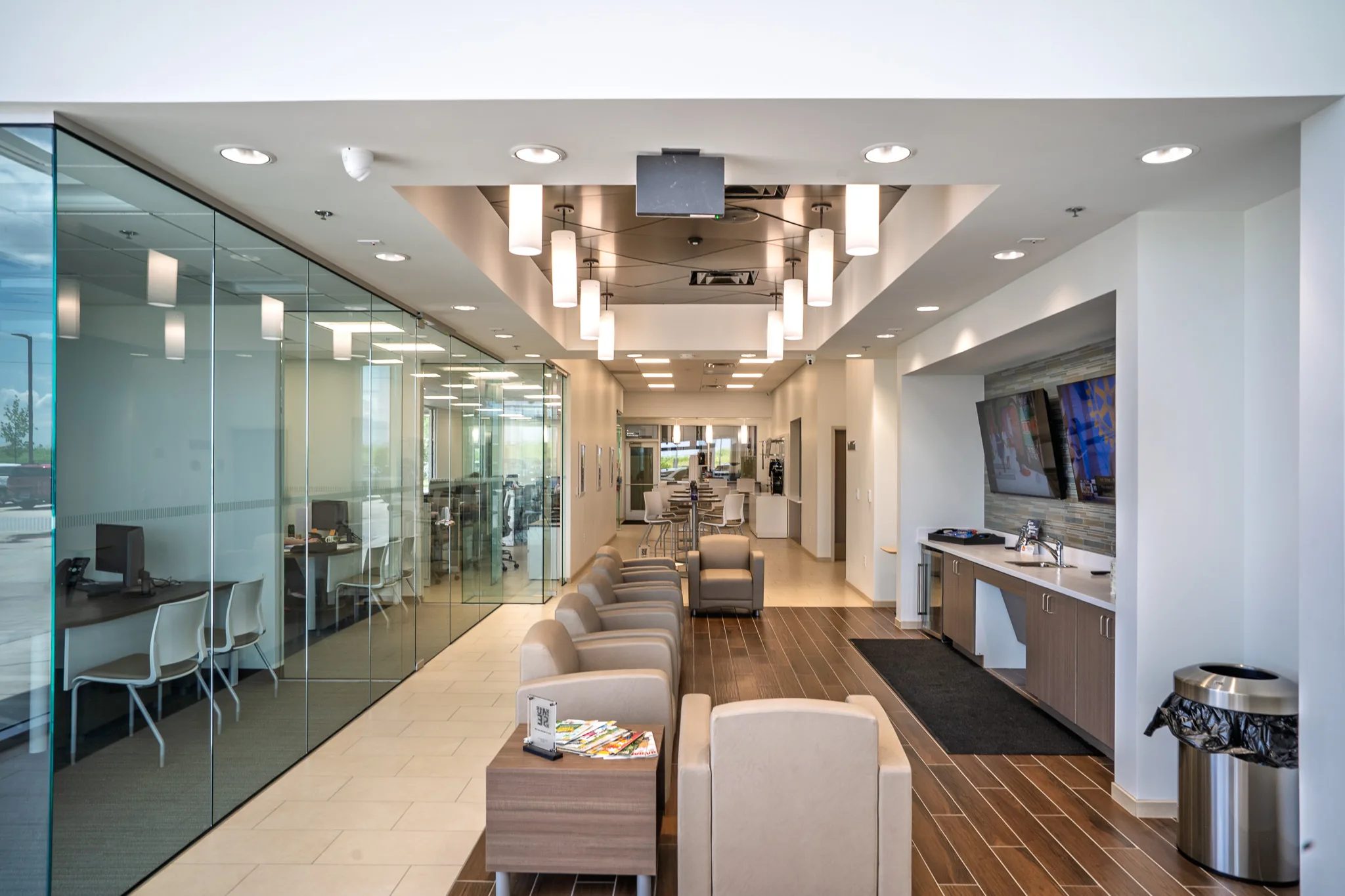 Customer lounge with leather chairs and a coffee bar at Clay Cooley Hyundai of Terrell in Terrell, Texas, built by The Charles Morgan Group