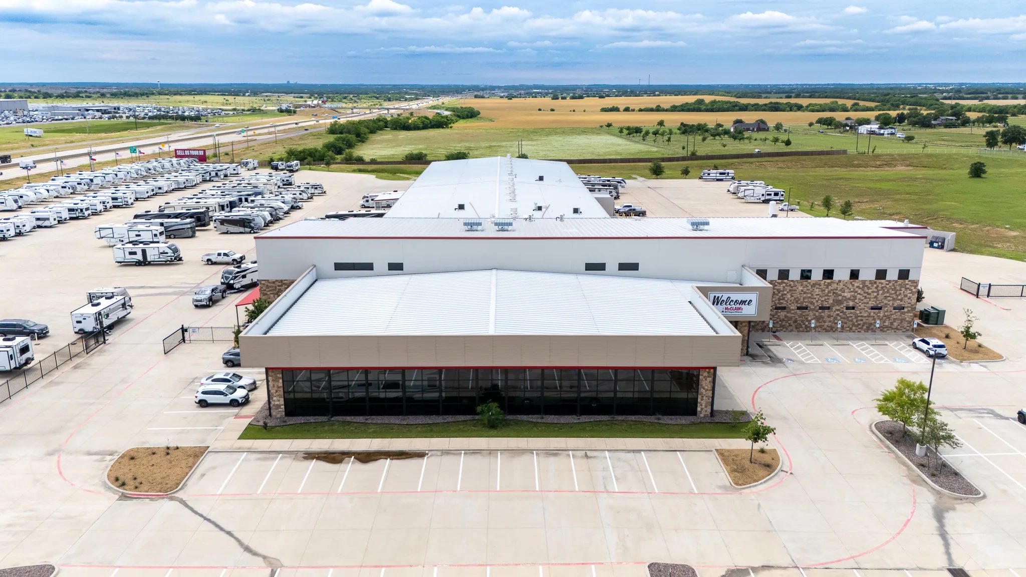 Aerial view of McClain's RV SuperStore in Sanger, Texas, with its showroom, long service building and RV inventory, built by The Charles Morgan Group