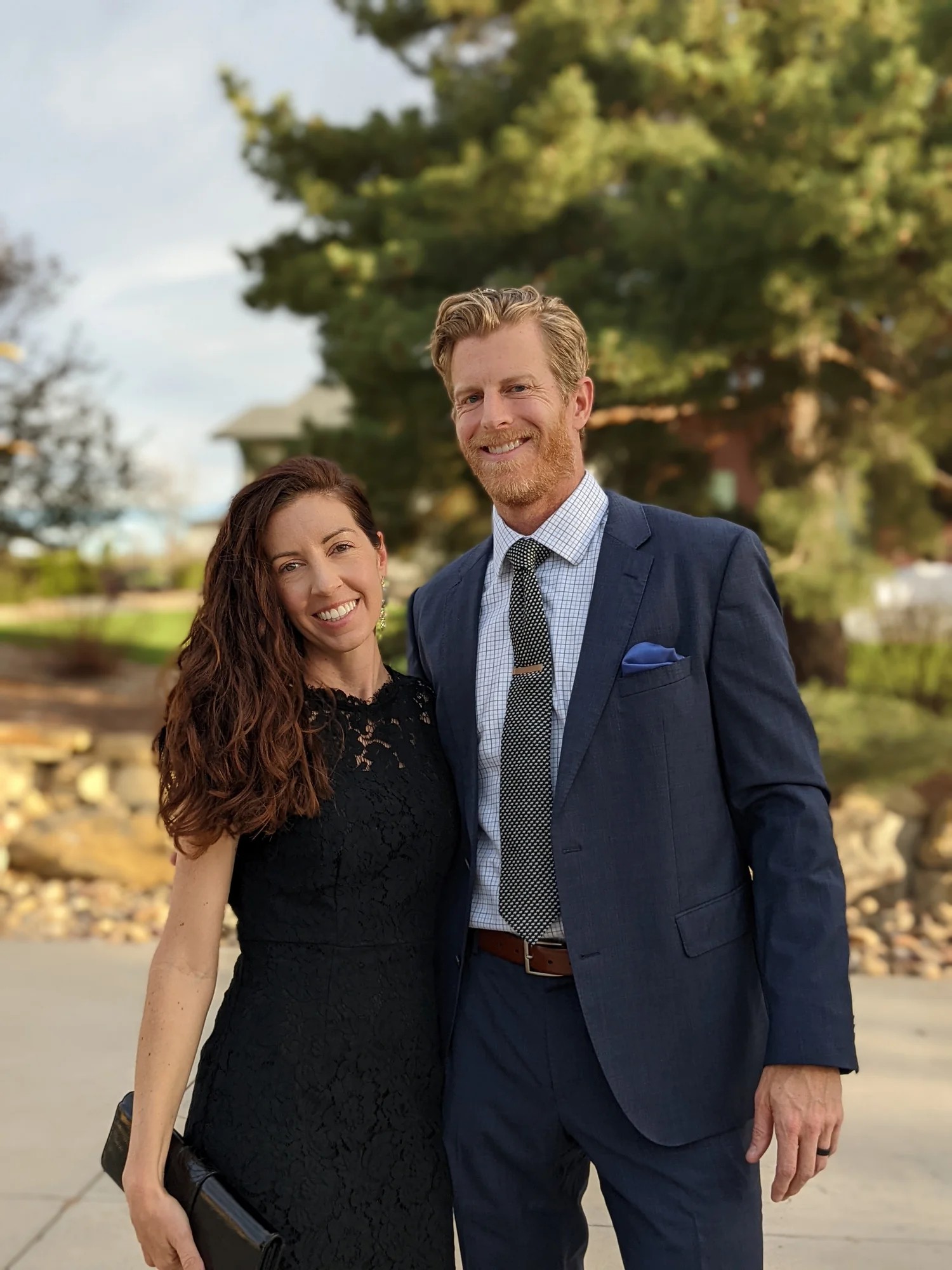 Cody and Holly Strate, the married couple who run UPWARD, smiling together outdoors.