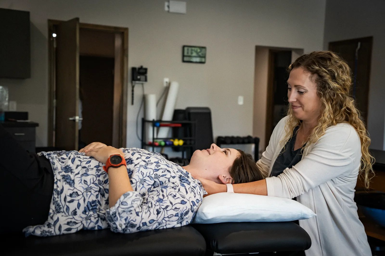 A physical therapist treating a patient at IRG Physical Therapy, photographed by UPWARD