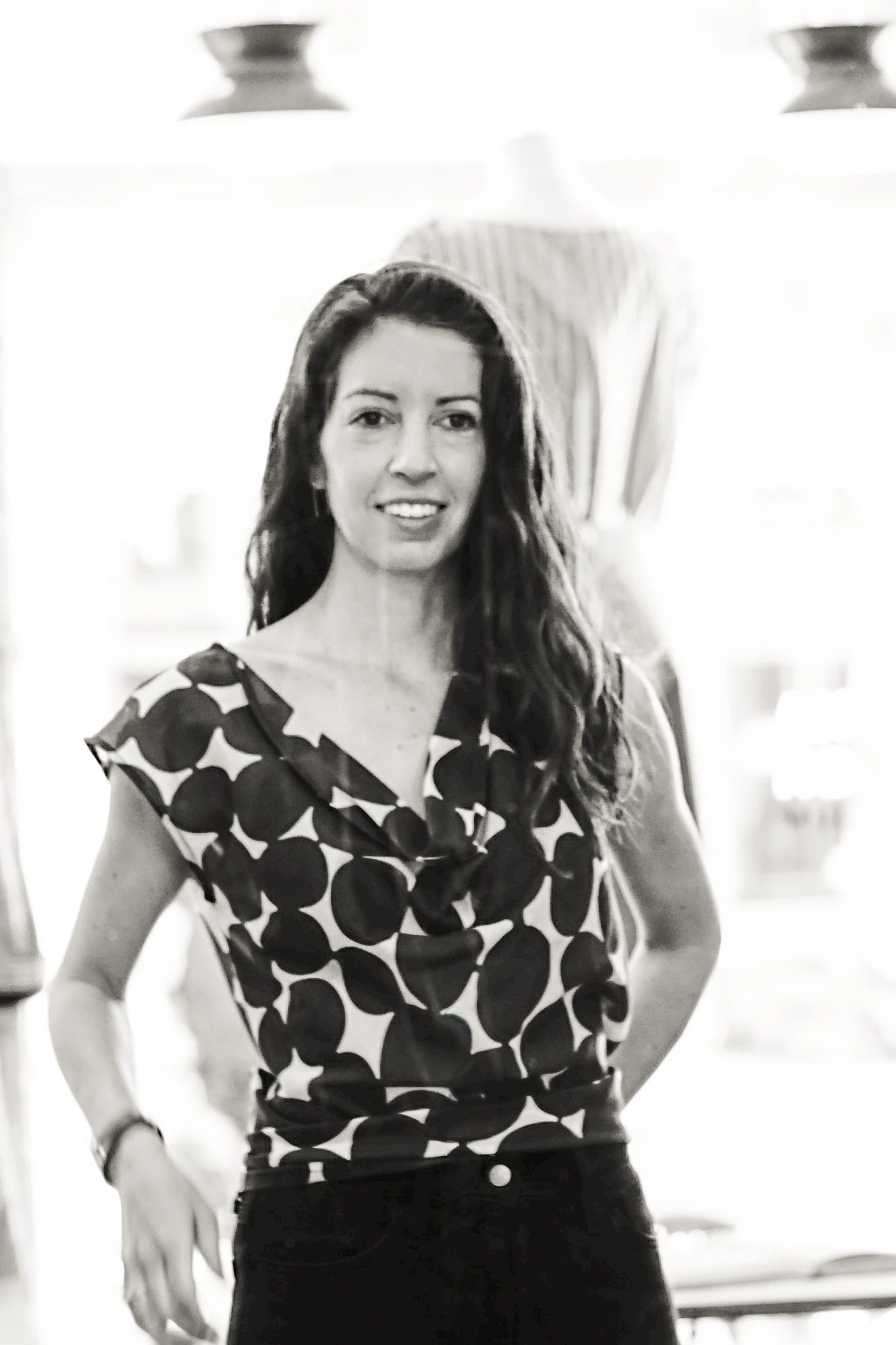 Holly Strate, partner at UPWARD, smiling in black and white.
